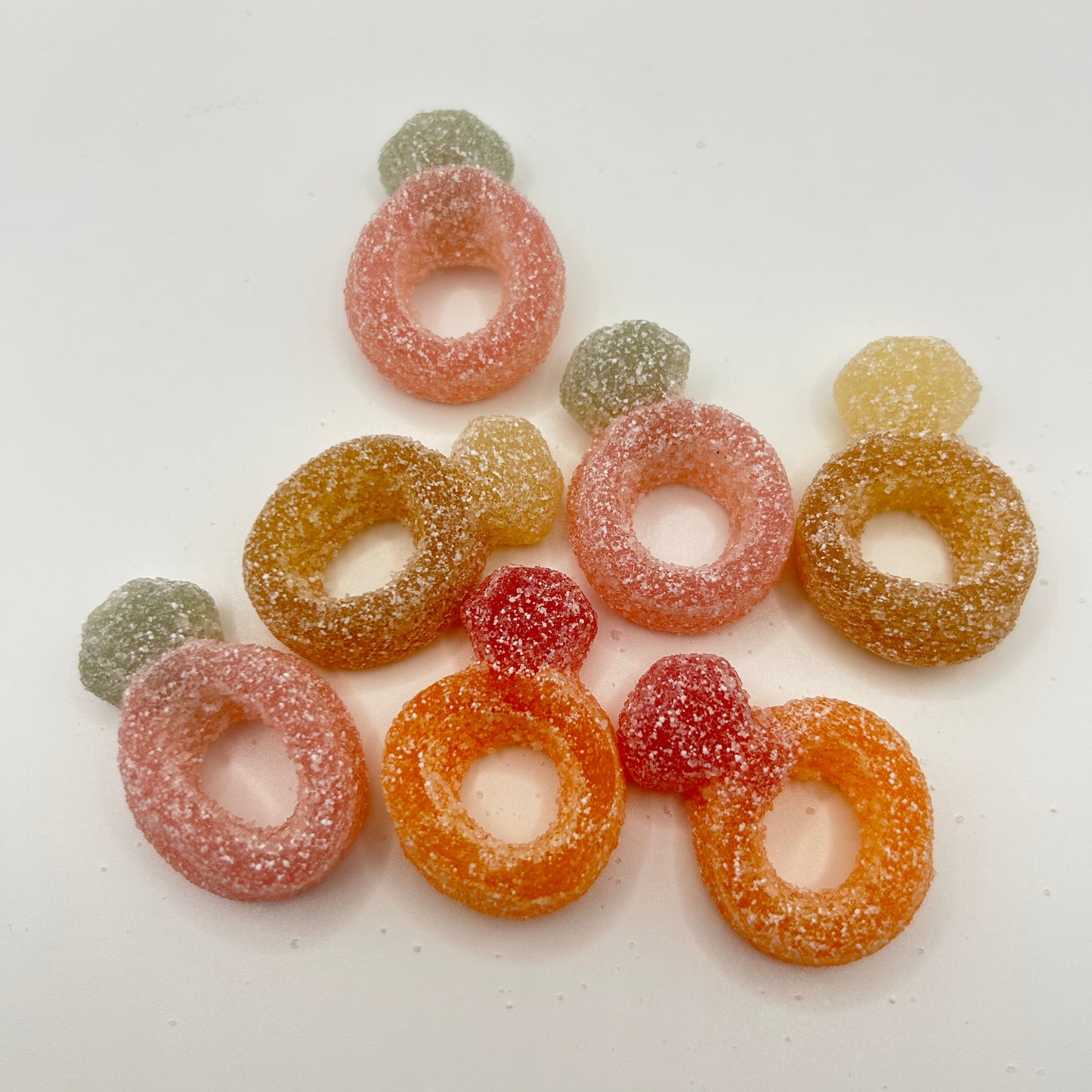 Colorful gummy candy rings on a white background
