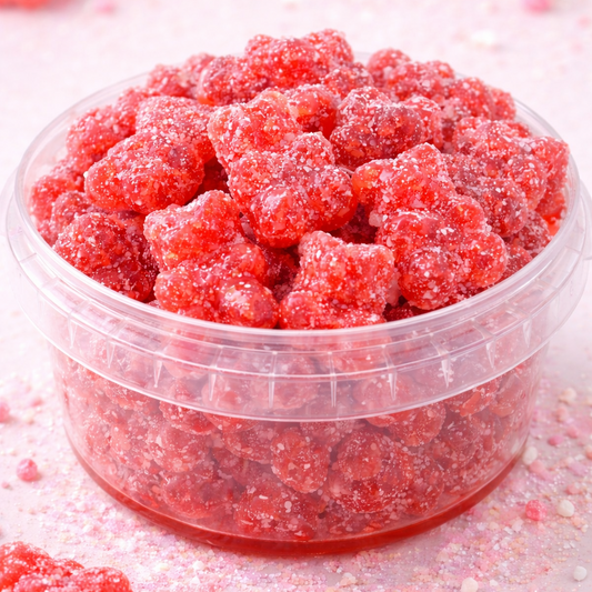 Clear container filled with red gummy candies on a light background