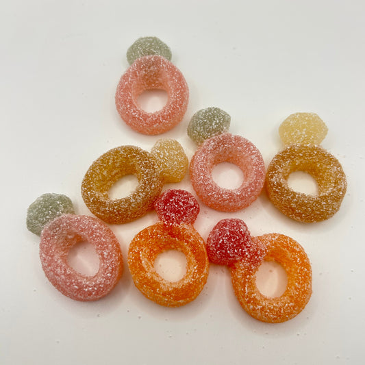 Colorful gummy candy rings on a white background